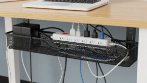 Under-desk cable tray used for cable management on a small desk