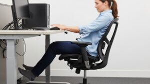 Desk height trap: chair raised too high to reach the desk causes unstable feet, sliding forward, and the seat feeling too deep